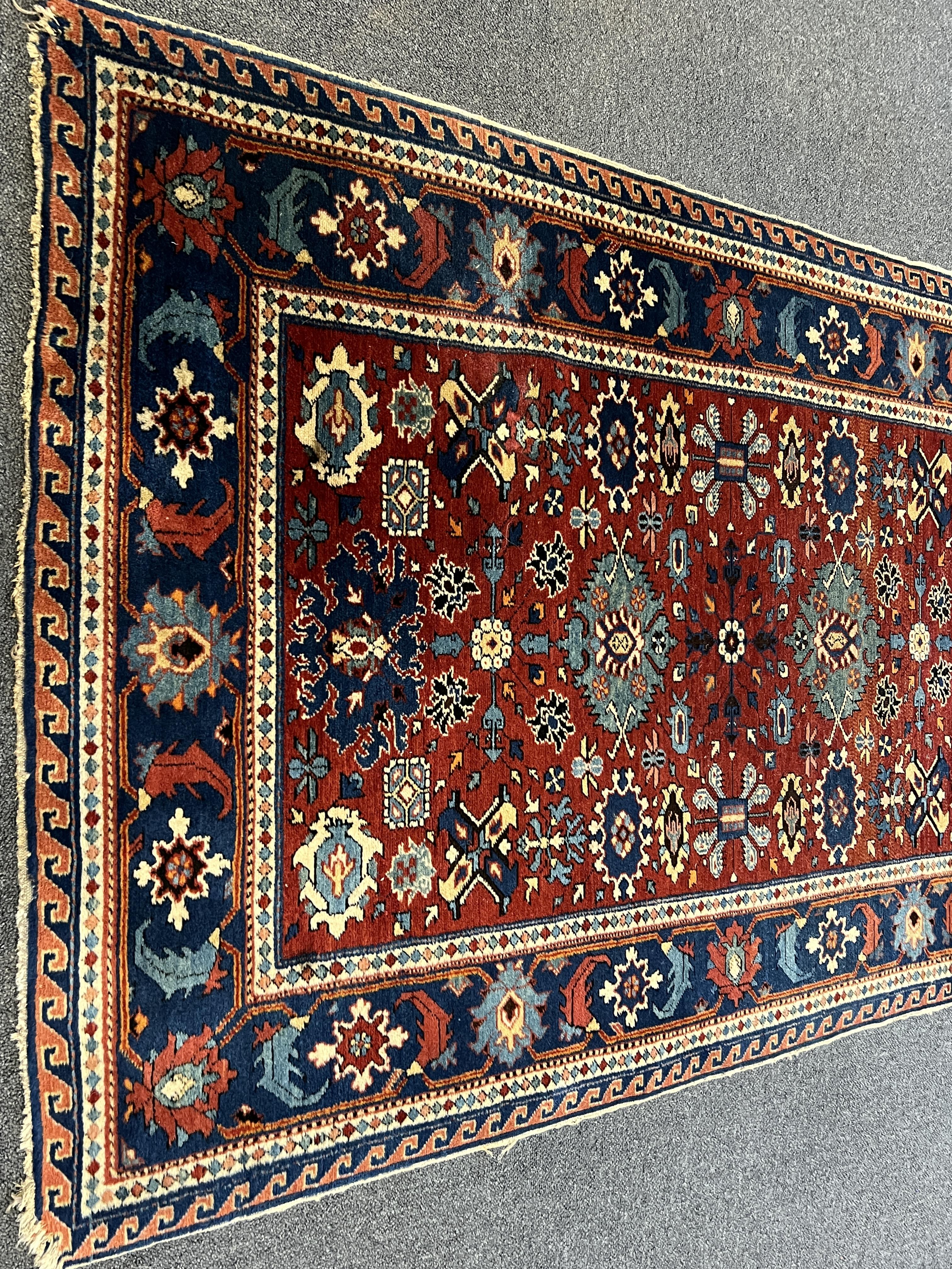 A Shiraz rug, the red field, 153 x 98cm